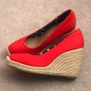 Size 7 1/2 wedges.  Red orange color.